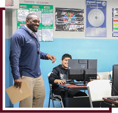 High school teacher in the computer lab with students